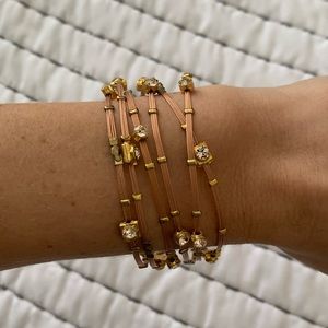 Set of 6 tan and gold bracelets